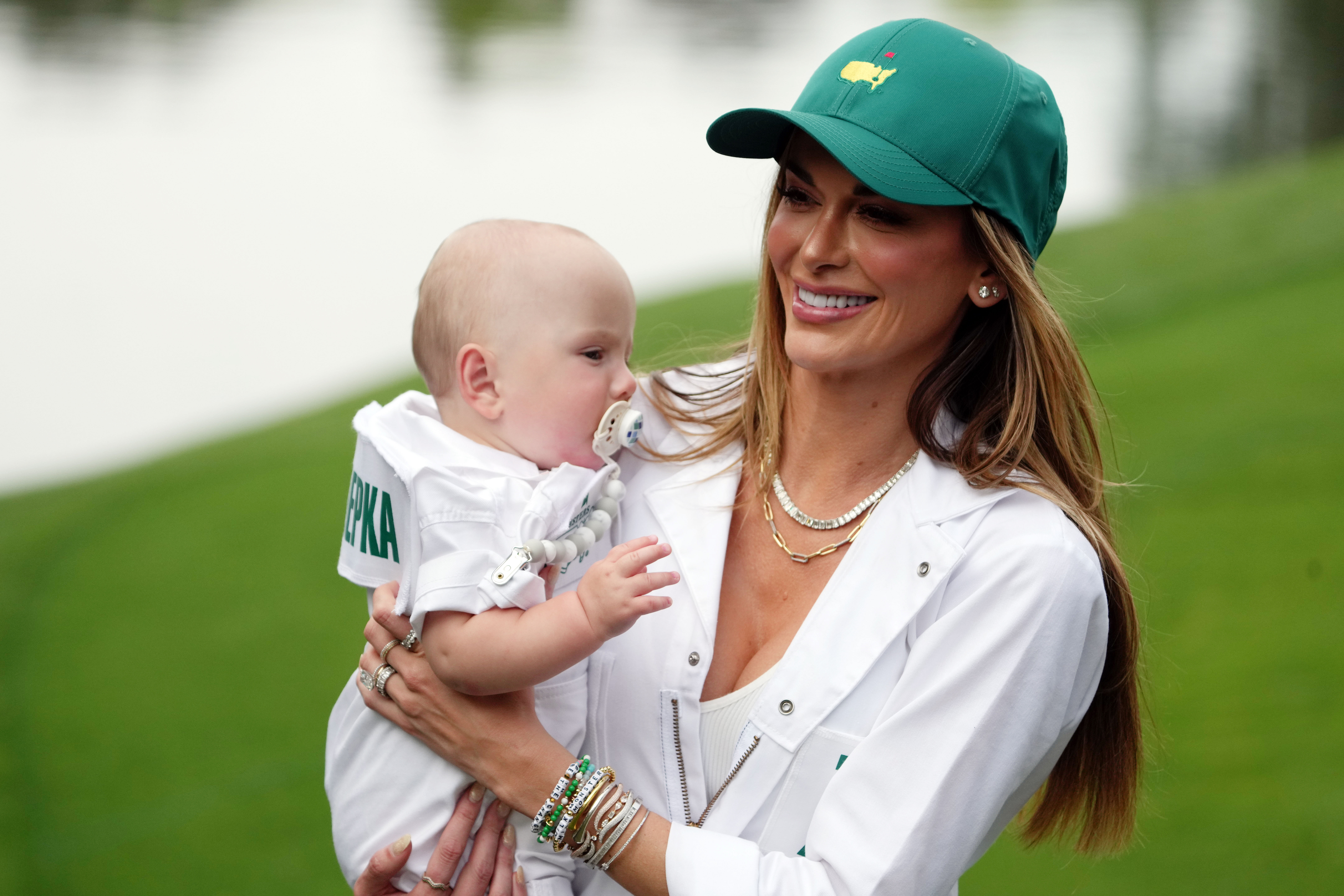 Sims with her son Crew during PGA: Masters Tournament - Par 3 Contest - Source: Imagn